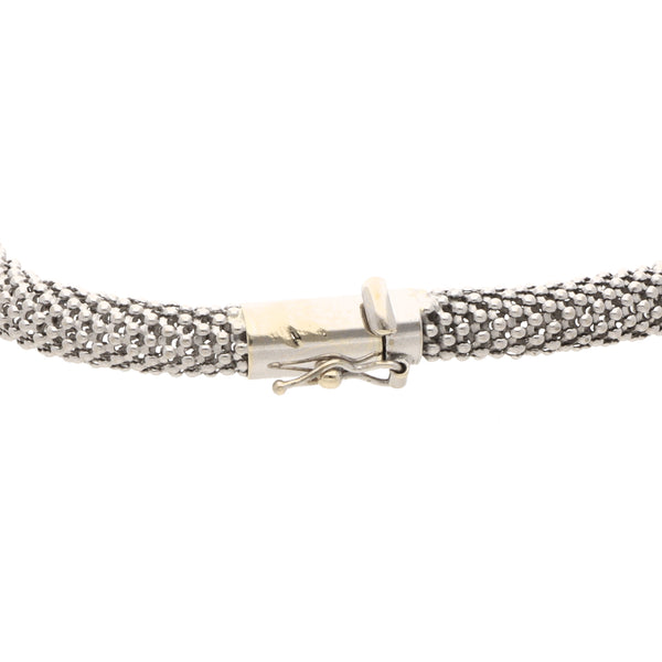 Pulsera eslabón calado laminado en oro blanco 18 kilates.