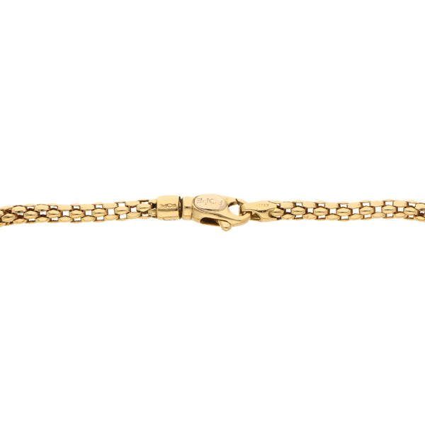 Pulsera eslabón laminado hueco en oro amarillo 18 kilates.