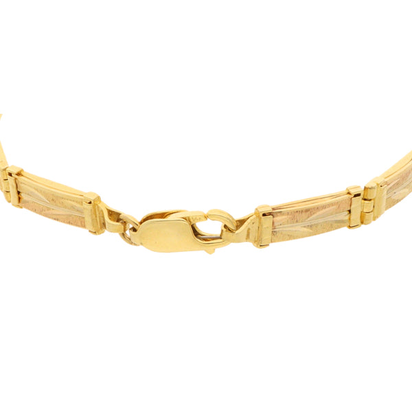 Pulsera eslabón articulado motivo floral en oro amarillo 14 kilates.