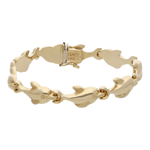 Pulsera eslabón articulado motivo delfines en oro amarillo 14 kilates.