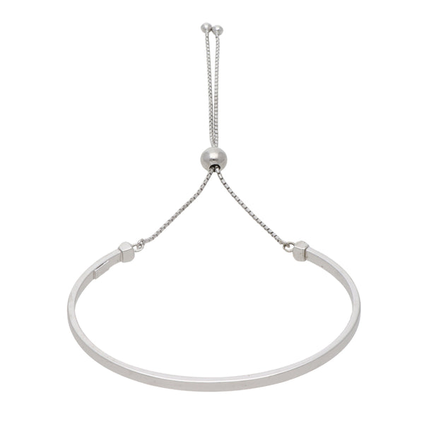 Pulsera abierta lisa en oro blanco 14 kilates.