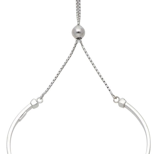 Pulsera abierta lisa en oro blanco 14 kilates.