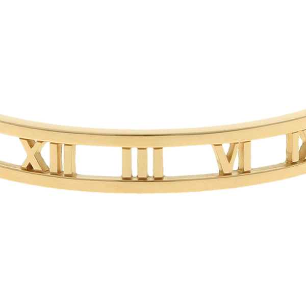 Pulsera de arillo calada firma Tiffany & Co. motivo números romanos en oro amarillo 18 kilates.