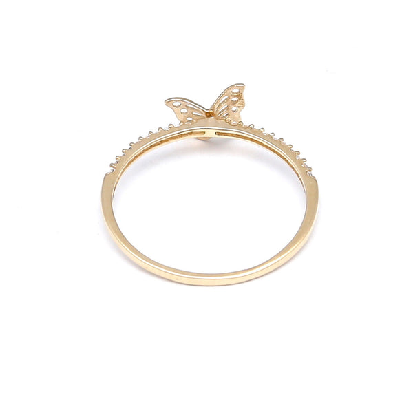 Anillo calado motivo mariposa con circonias en oro amarillo 14 kilates.