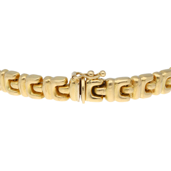 Pulsera eslabón articulado hueco en oro amarillo 18 kilates.