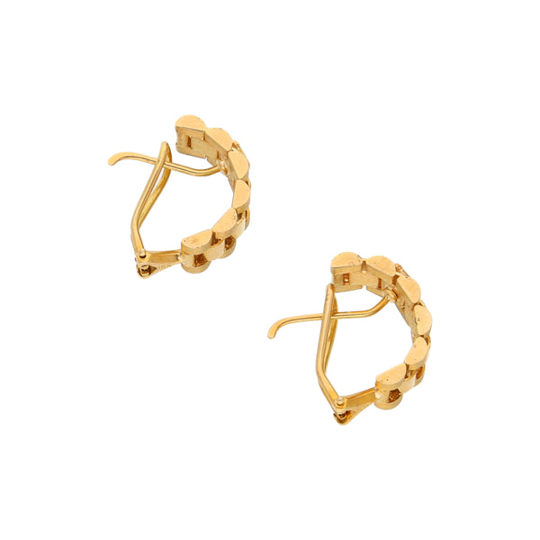 Aretes calados en oro amarillo 18 kilates.