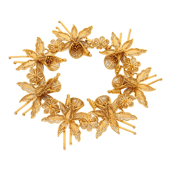 Pulsera eslabón combinado motivo floral en oro amarillo 10 kilates.