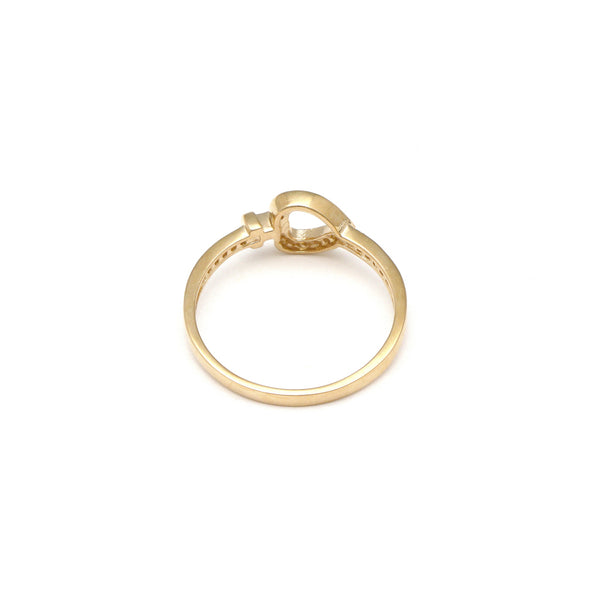 Anillo calado motivo corazón con circonias en oro amarillo 14 kilates.