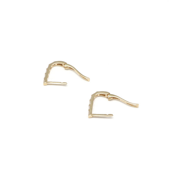 Aretes articulados con circonias en oro amarillo 14 kilates.