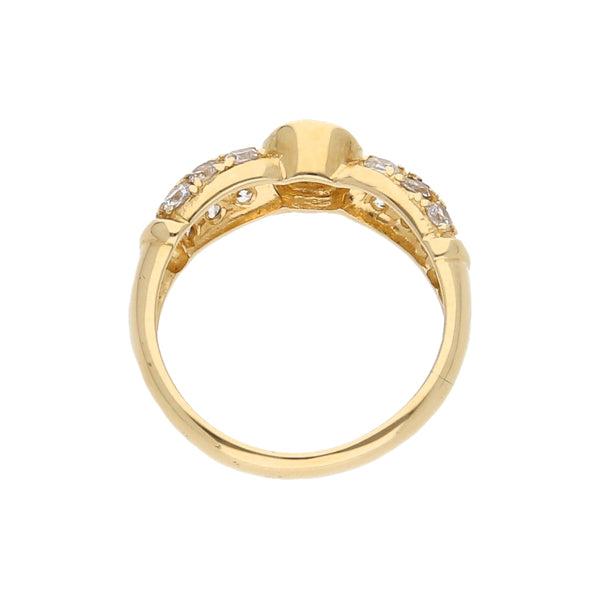 Anillo estilizado con circonias y sintéticos en oro amarillo 14 kilates.