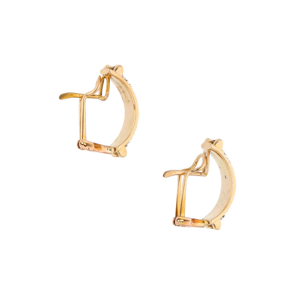 Aretes diseño especial con diamantes en oro amarillo 14 kilates.