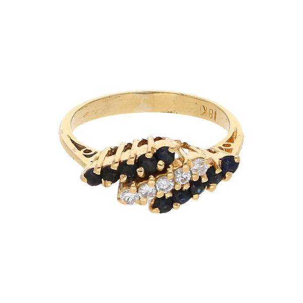 Anillo diseño especial con zafiros y circonias en oro amarillo 18 kilates.