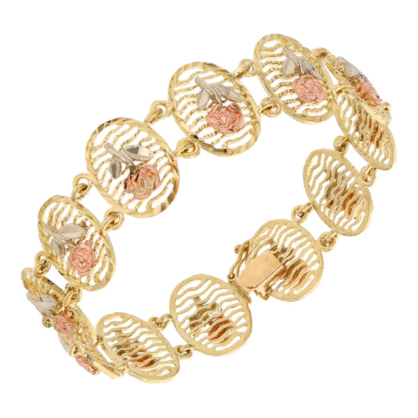 Pulsera eslabón articulado motivo floral en oro tres tonos 14 kilates.