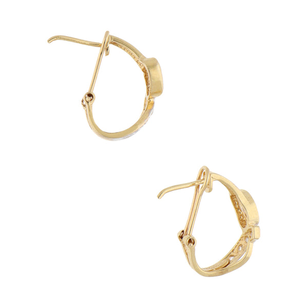 Aretes diseño especial con circonias en oro amarillo 14 kilates.