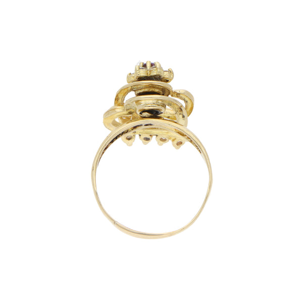 Anillo giratorio motivo floral y corazones con circonias, sintéticos en oro amarillo 14 kilates.