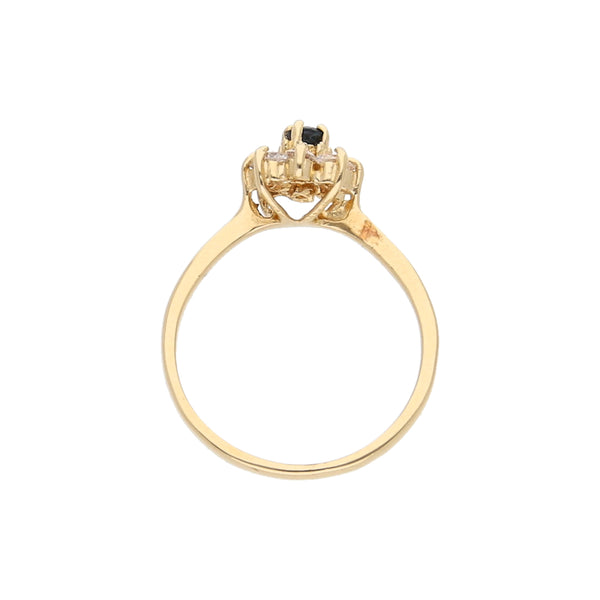 Anillo estilizado motivo floral con circonias y zafiro en oro amarillo 14 kilates.