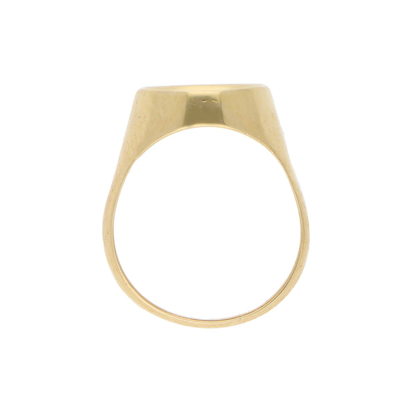 Anillo tipo sello con ónix en oro amarillo 18 kilates.