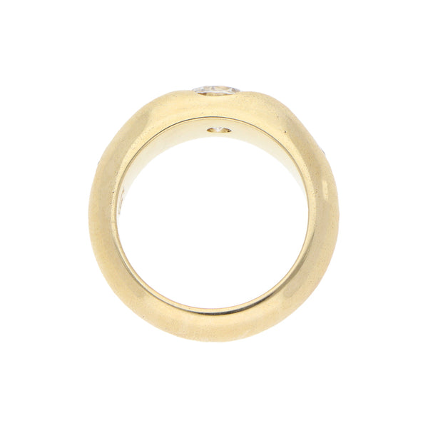 Anillo estilizado con circonia y esmeraldas en oro amarillo 14 kilates.