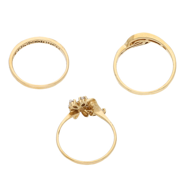 Tres anillos diseño especial con circonias en oro amarillo 14 kilates.