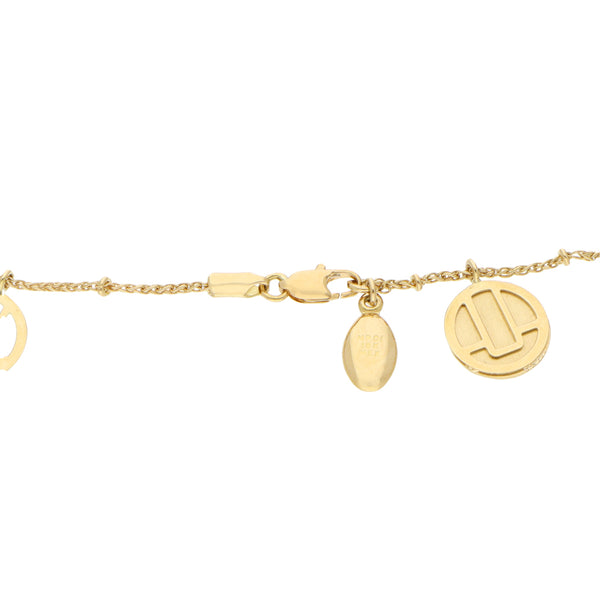 Pulsera eslabón encontrado doble con dijes en oro amarillo 18 kilates.