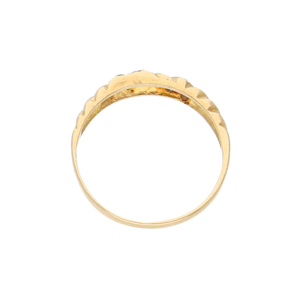 Anillo acanalado con sintéticos en oro amarillo 14 kilates.