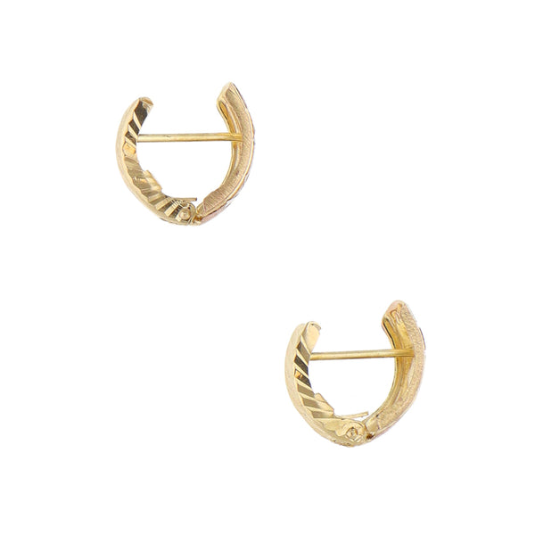 Aretes labrados en oro amarillo 14 kilates.