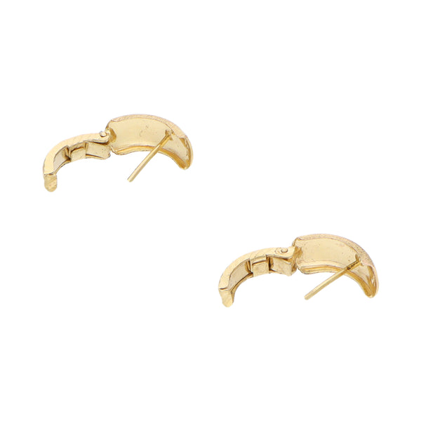 Aretes labrados en oro amarillo 14 kilates.