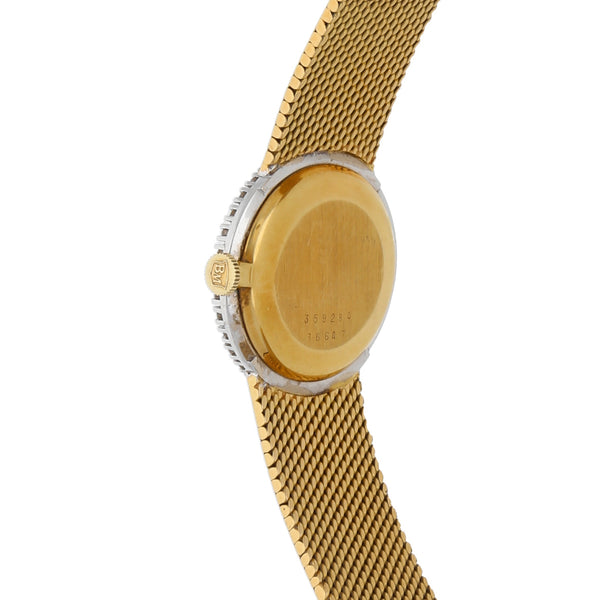 Reloj Baume & Mercier para dama en oro amarillo 18 kilates vistas en tono blanco.