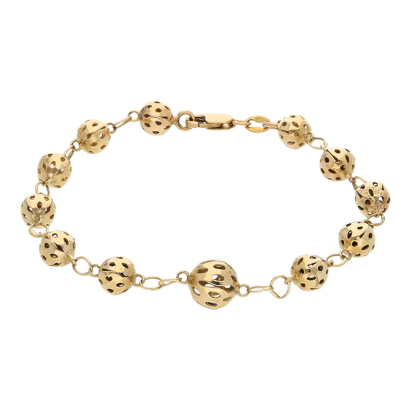 Pulsera eslabón combinado motivo esferas en oro amarillo 14 kilates.