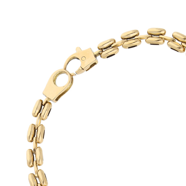 Pulsera eslabón articulado combinado con sintéticos en oro amarillo 14 kilates.