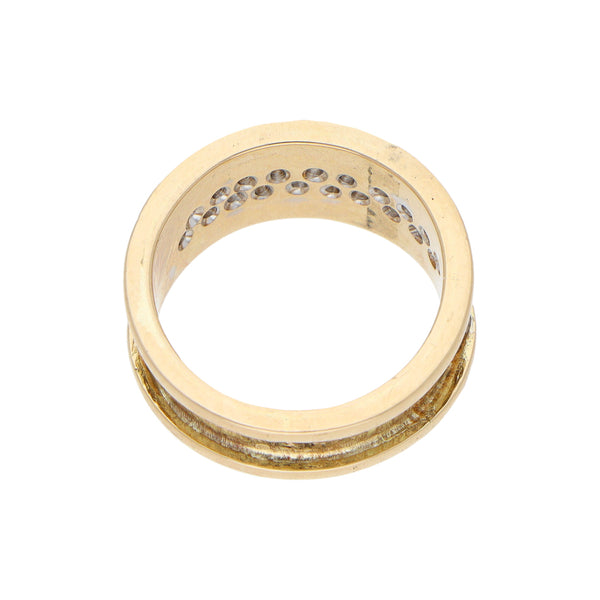 Anillo estilizado con diamantes en oro amarillo 14 kilates.