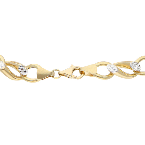 Pulsera eslabón combinado platinado en oro amarillo 14 kilates.