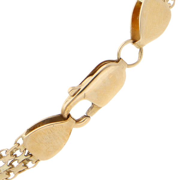 Pulsera eslabón articulado combinado en oro amarillo 14 kilates.