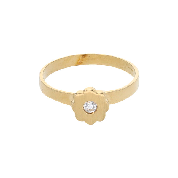 Anillo liso con aplicación motivo floral y circonia en oro amarillo 14 kilates.