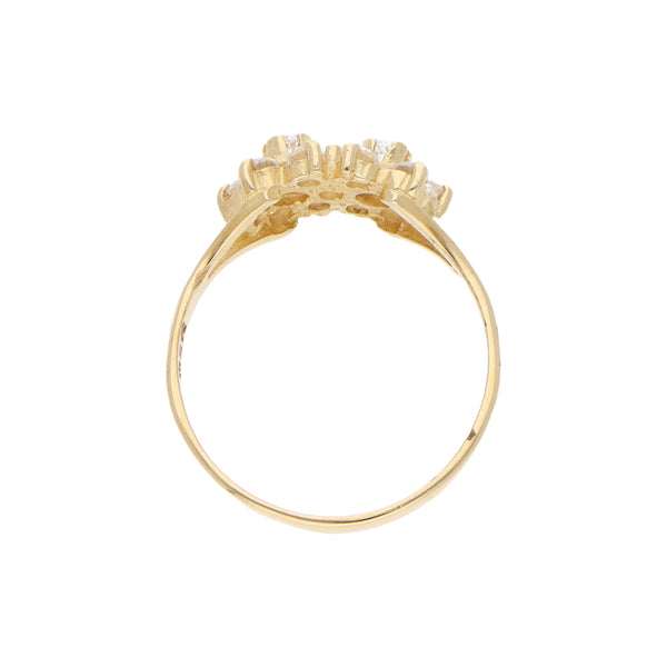 Anillo calado motivo floral con circonias en oro amarillo 14 kilates.