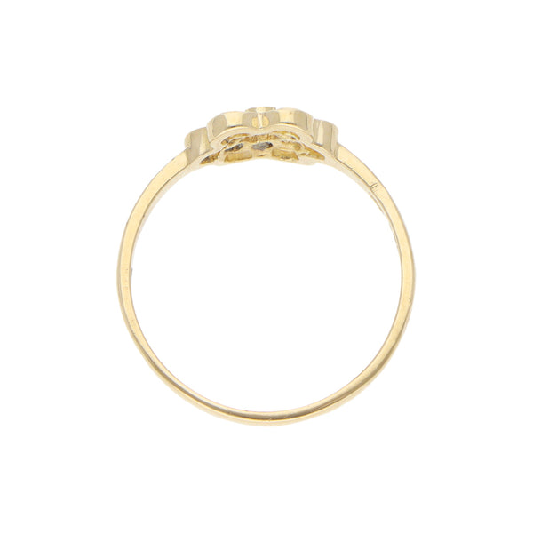 Anillo calado motivo floral con sintéticos en oro amarillo 14 kilates.