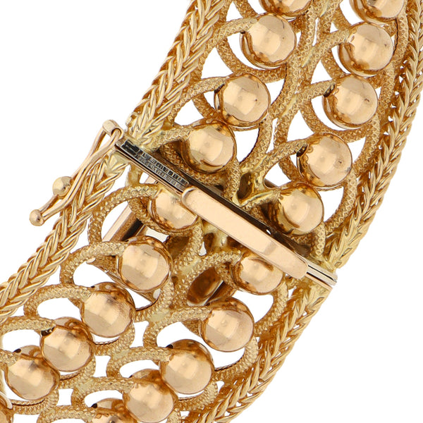 Pulsera eslabón combinado con esferas en oro amarillo 18 kilates.