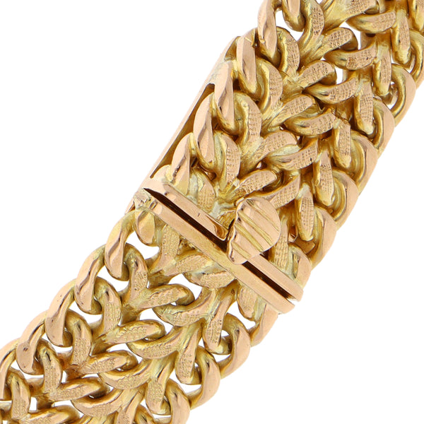 Pulsera eslabón palmeado en oro amarillo 18 kilates.