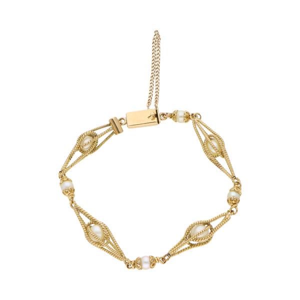 Pulsera eslabón combinado con perlas en oro amarillo 18 kilates.