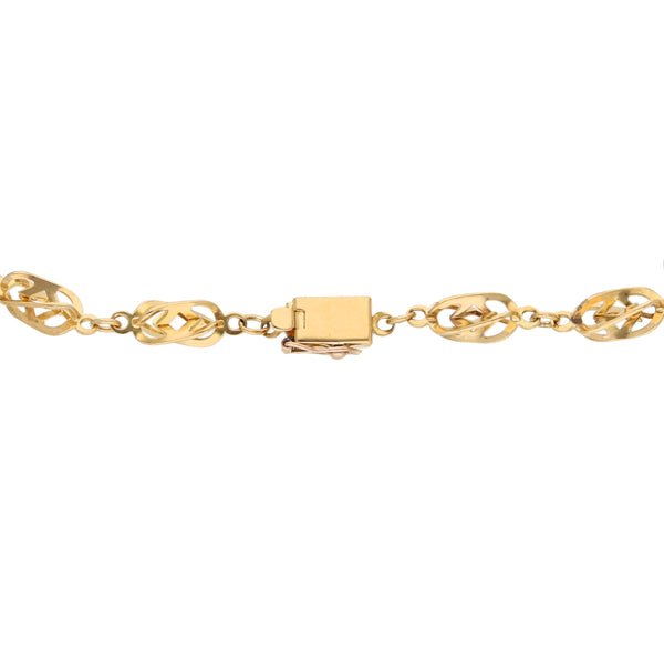 Pulsera eslabón combinado en oro amarillo 18 kilates.