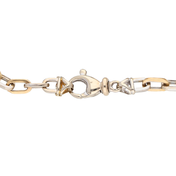 Pulsera eslabón cruzado en oro dos tonos 14 kilates.