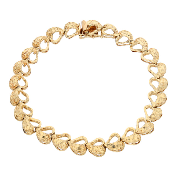 Pulsera eslabón articulado motivo corazones en oro amarillo 14 kilates.