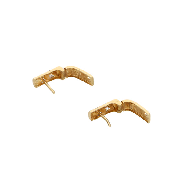 Aretes articulados con sintéticos en oro amarillo 14 kilates.