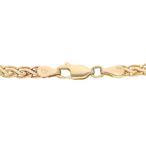 Pulsera eslabón tejido en oro amarillo 14 kilates.