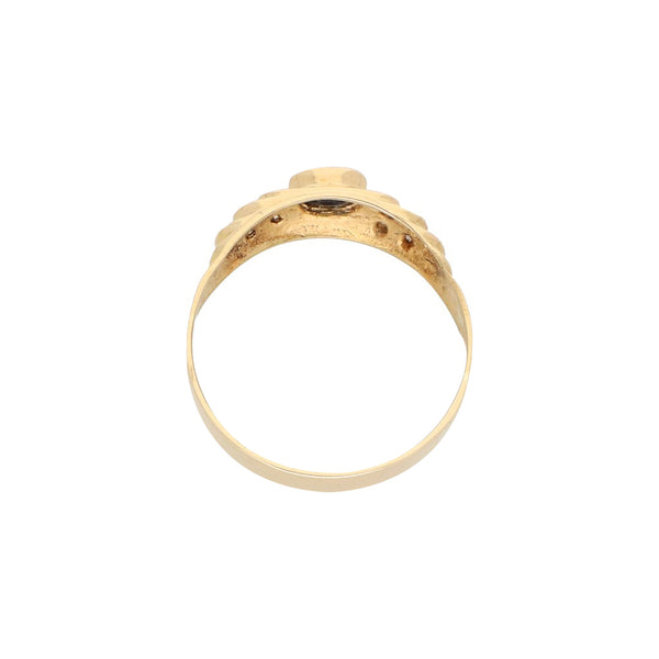 Anillo diseño especial con diamantes y sintético en oro amarillo 14 kilates.