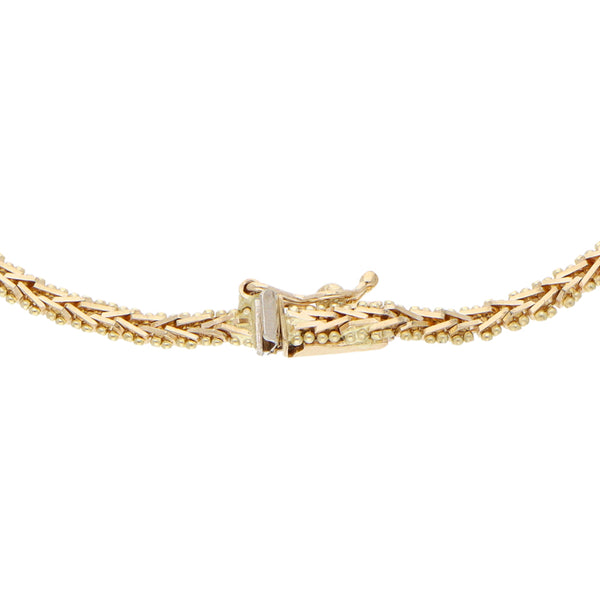 Pulsera eslabón boleado con aplicación en oro amarillo 14 kilates.