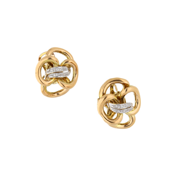 Aretes estilizados con diamantes en oro amarillo 18 kilates.