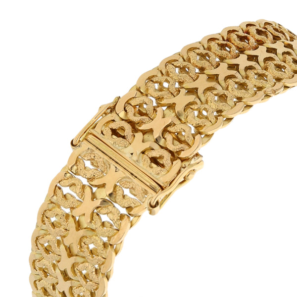 Pulsera eslabón palmeado en oro amarillo 18 kilates.