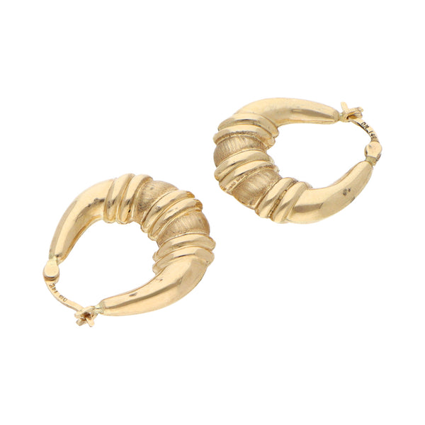 Arracadas huecas en oro amarillo 14 kilates.