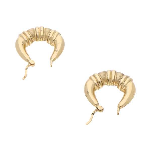 Arracadas huecas en oro amarillo 14 kilates.
